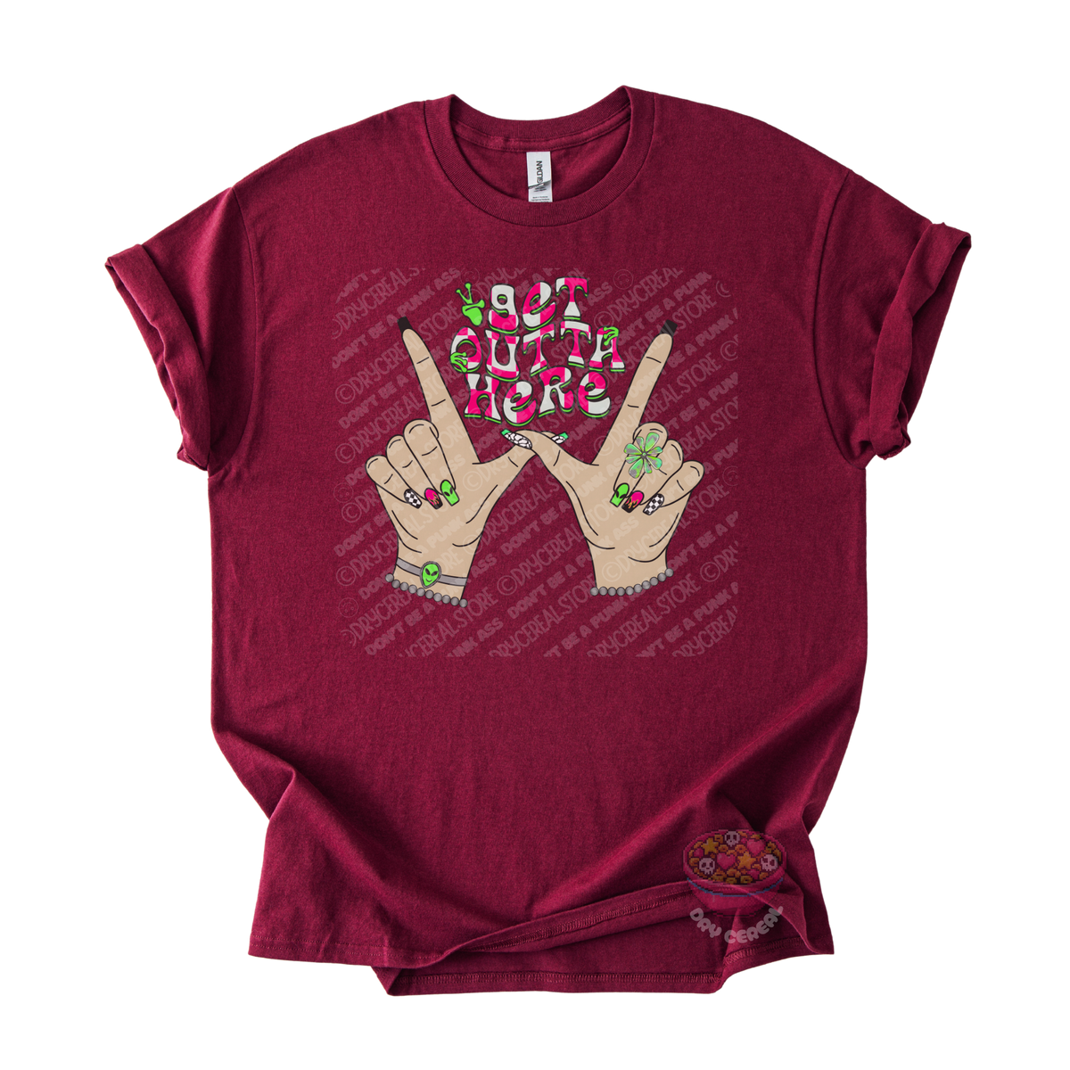 Maroon unisex T-shirt featuring the phrase "Get Outta Here" above Y2K-inspired hands making the iconic gesture with colorful nails, alien accents, bracelets, and retro lettering.