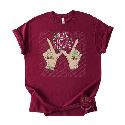 Maroon unisex T-shirt featuring the phrase "Get Outta Here" above Y2K-inspired hands making the iconic gesture with colorful nails, alien accents, bracelets, and retro lettering.