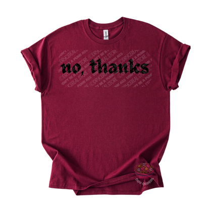 Maroon unisex T-shirt featuring the phrase "No, thanks" in bold black gothic lettering across the chest.
