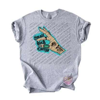 A heather gray short-sleeve t-shirt with a graphic on the front showing a hand gesture and the text 'Small Dick Energy' in black and teal.