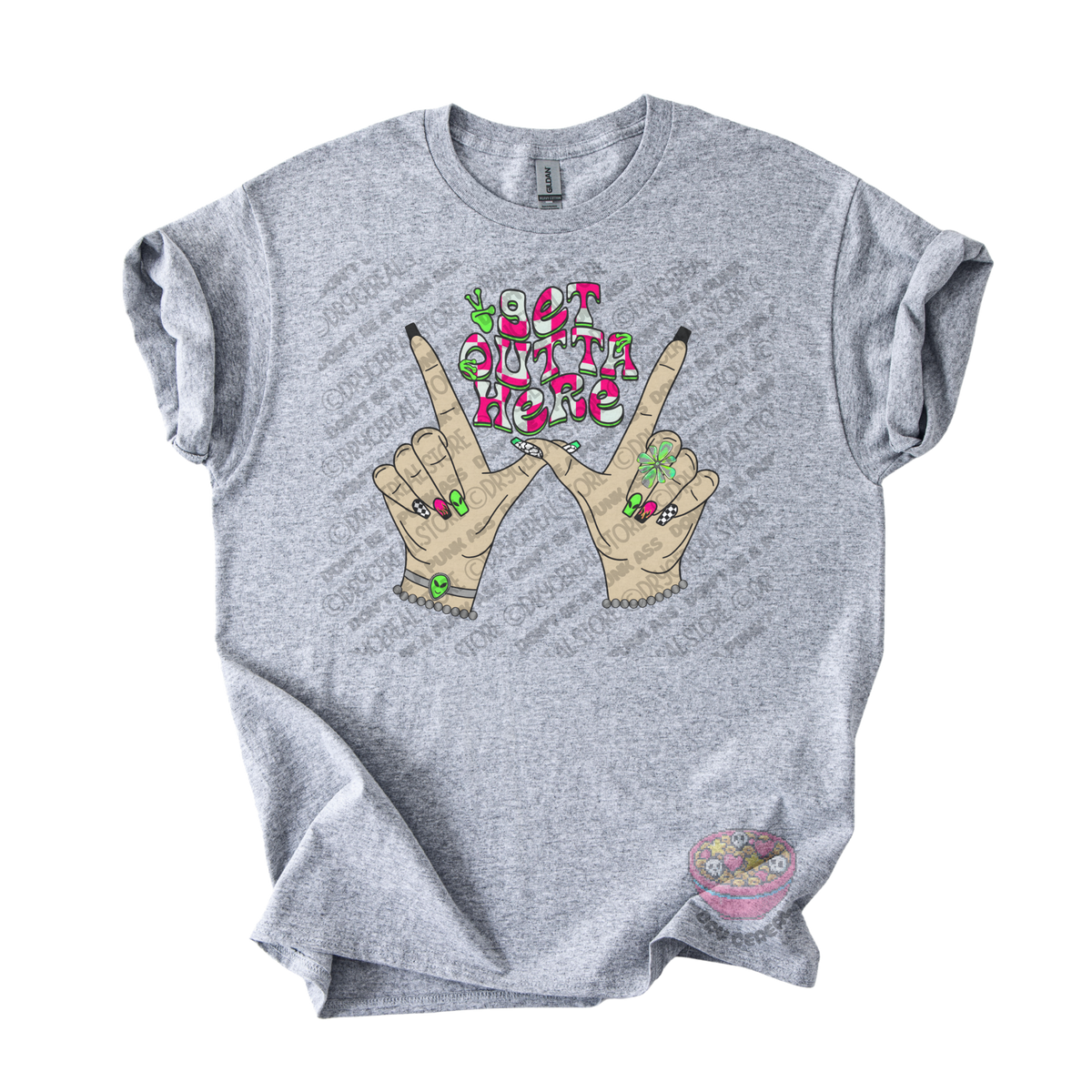 Light gray unisex T-shirt featuring the phrase "Get Outta Here" above Y2K-inspired hands making the iconic gesture with colorful nails, alien accents, bracelets, and retro lettering.