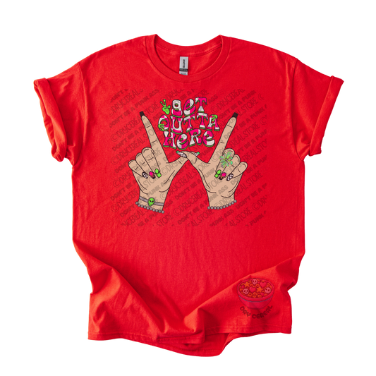 Red unisex T-shirt featuring the phrase "Get Outta Here" above Y2K-inspired hands making the iconic gesture with colorful nails, alien accents, bracelets, and retro lettering.