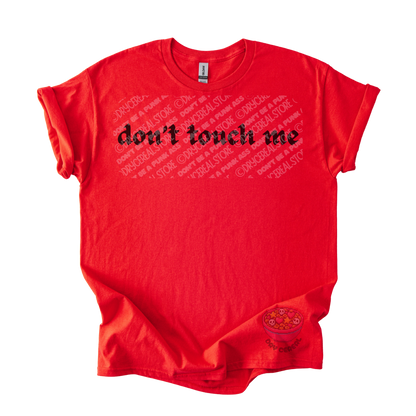 Red unisex tee featuring the phrase "don't touch me" in bold gothic black lettering across the chest.