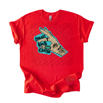 A bright red short-sleeve t-shirt with a graphic on the front showing a hand over a turquoise background with the text 'Small dick Energy'.