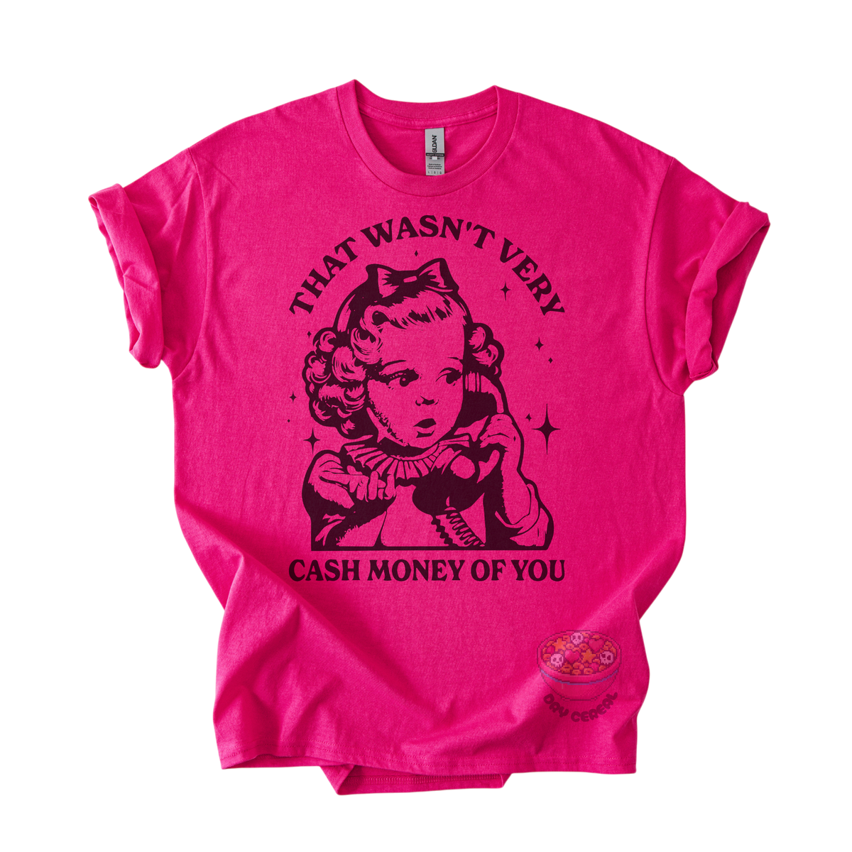 A bright pink short-sleeve graphic t-shirt featuring a black retro-style illustration of a woman on a telephone with the text 'THAT WASN'T VERY CASH MONEY OF YOU' printed on the front.