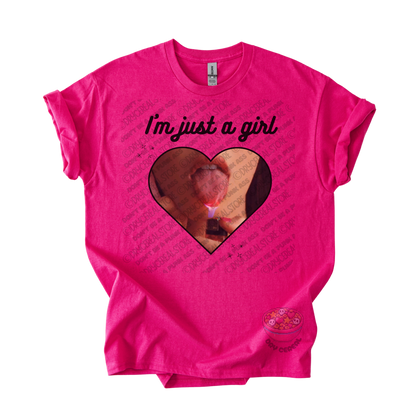 Hot pink unisex T-shirt featuring the phrase "I'm just a girl" above an original heart-shaped collage graphic with an edgy alternative aesthetic