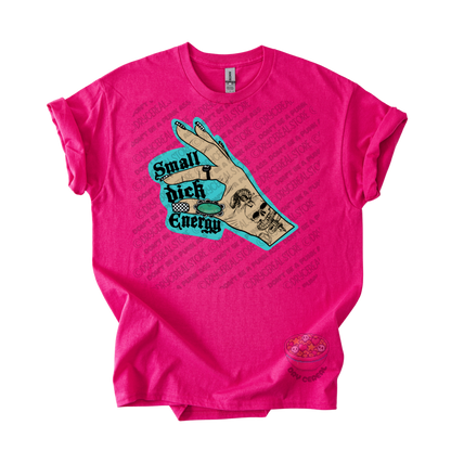 A bright pink short-sleeve t-shirt with a graphic on the front showing a hand over a turquoise background with the text 'Small dick energy'.