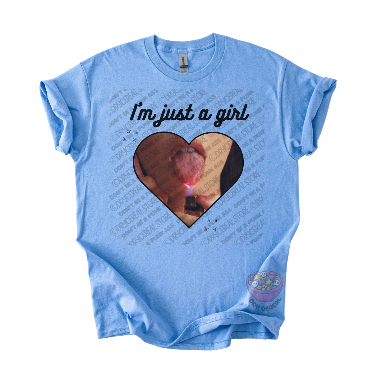 Light blue unisex T-shirt featuring the phrase "I'm just a girl" above an original heart-shaped collage graphic with an edgy alternative aesthetic
