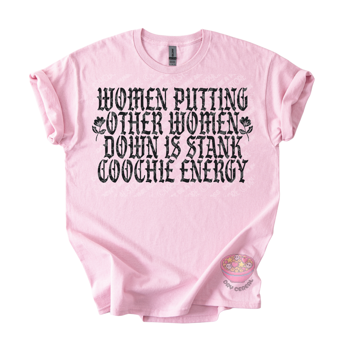 A light pink short-sleeve t-shirt with a black graphic text print that reads 'WOMEN PUTTING OTHER WOMEN DOWN IS STANK COOCHE ENERGY' accompanied by small floral illustrations. 