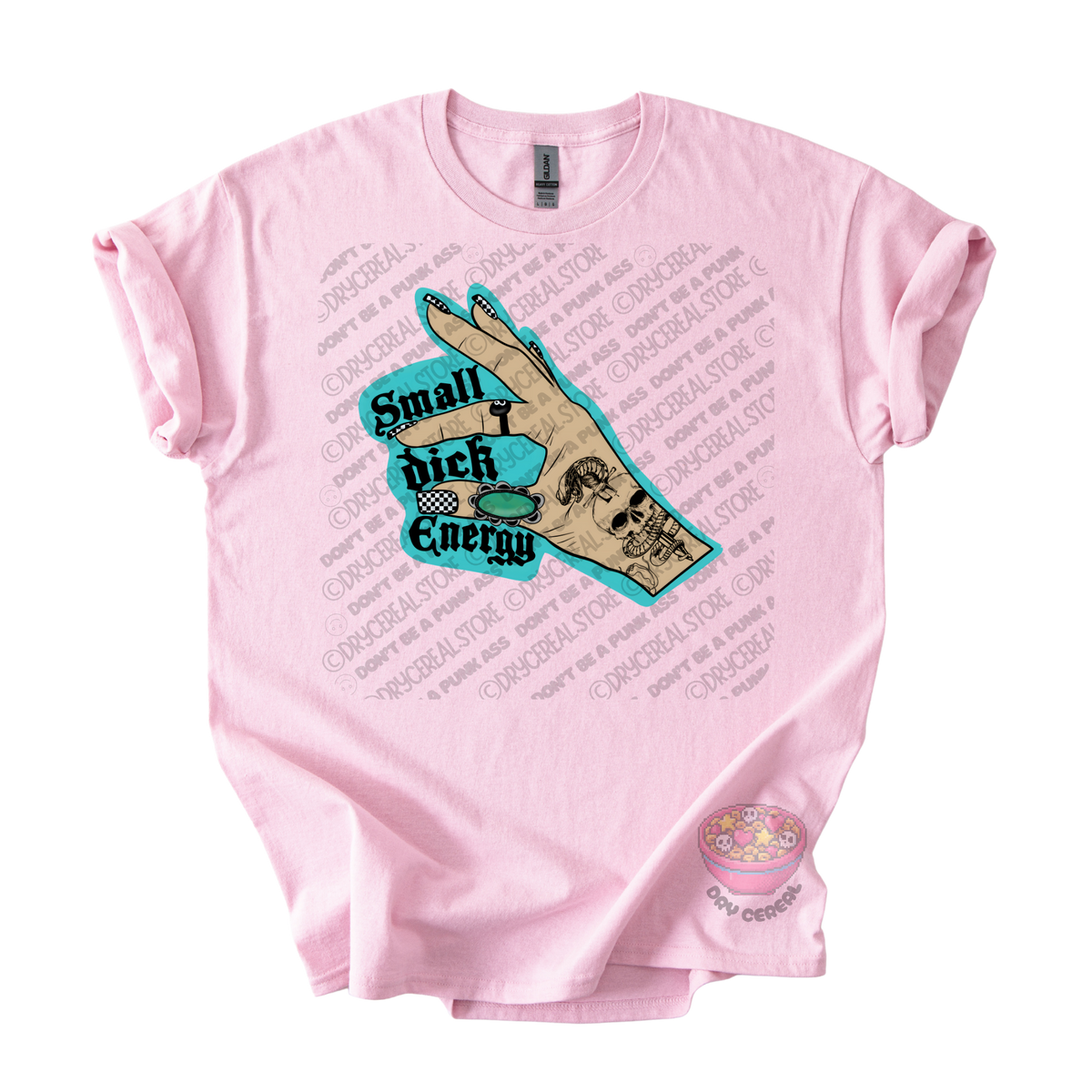 A light pink short-sleeve t-shirt with a graphic print on the front. The graphic features a tan hand holding a turquoise sign that reads 'Small Dick Energy' with a skull design.
