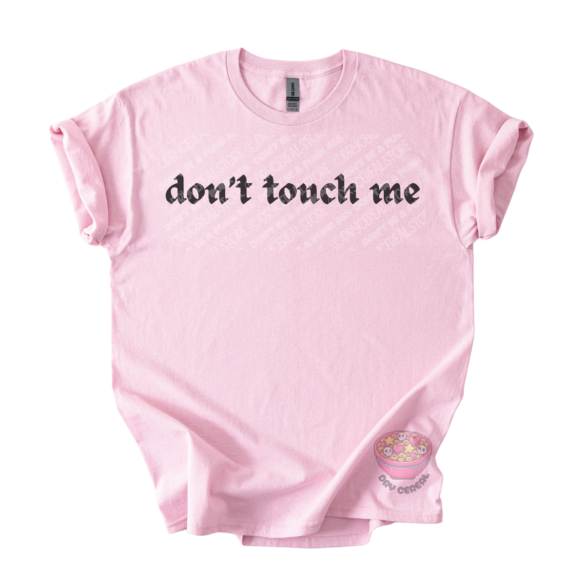Light pink unisex tee featuring the phrase "don't touch me" in bold gothic black lettering across the chest.