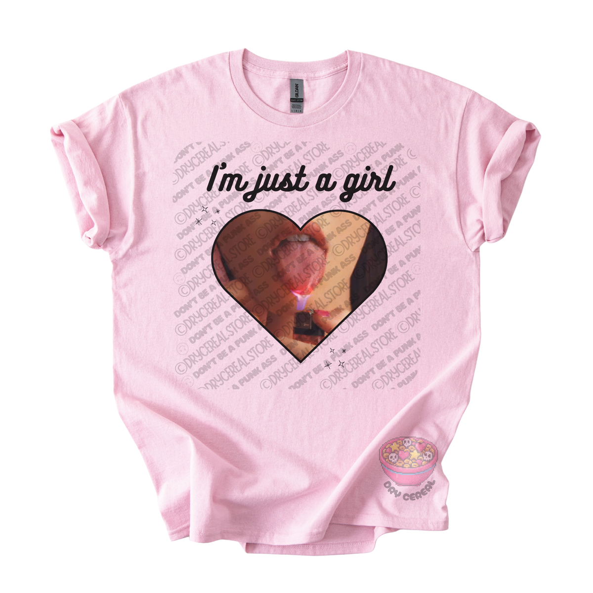 Light pink unisex T-shirt featuring the phrase "I'm just a girl" above an original heart-shaped collage graphic with an edgy alternative aesthetic