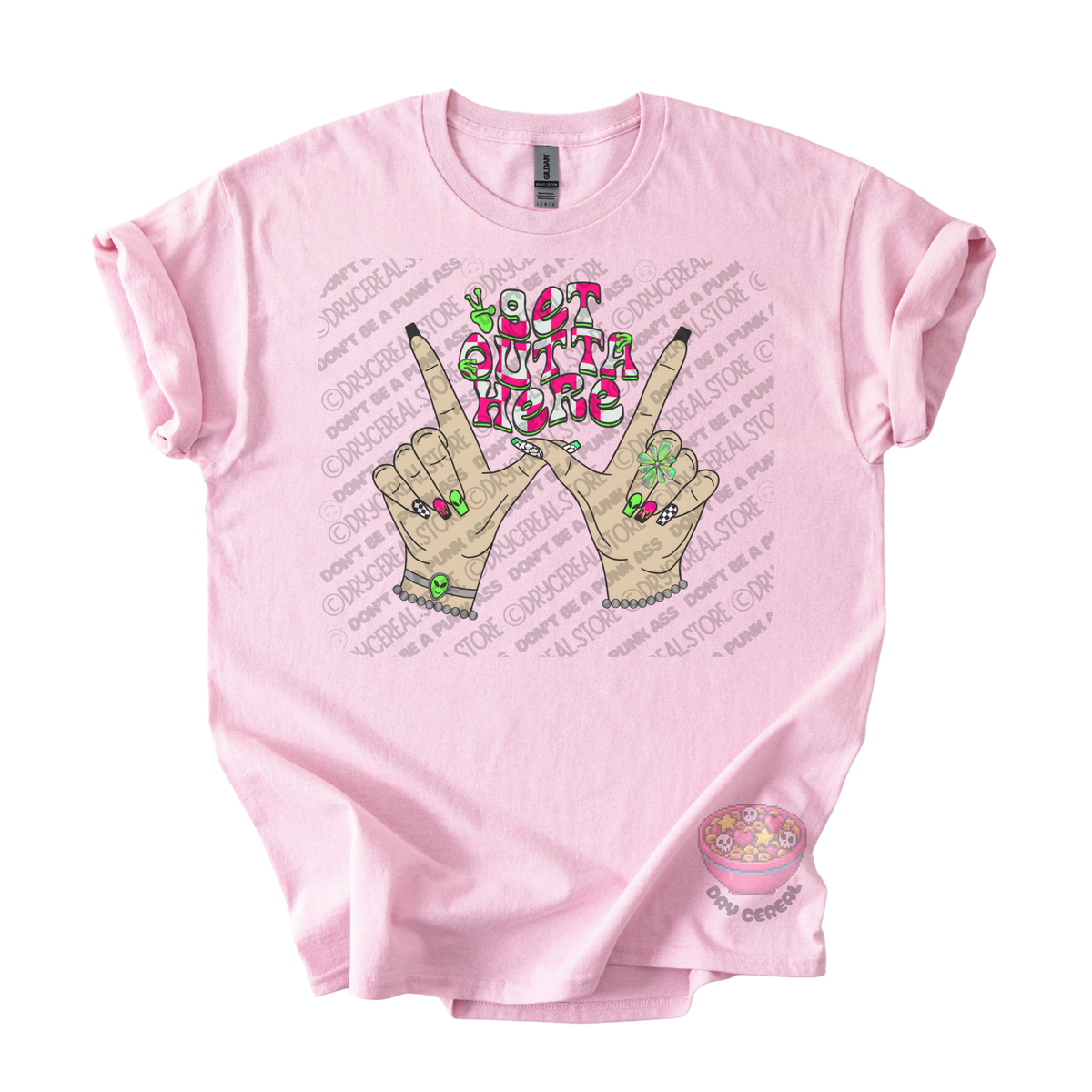 Light pink unisex T-shirt featuring the phrase "Get Outta Here" above Y2K-inspired hands making the iconic gesture with colorful nails, alien accents, bracelets, and retro lettering.