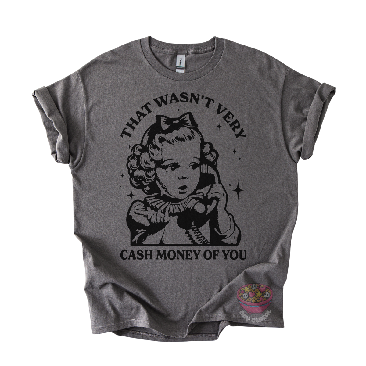 A dark gray graphic t-shirt featuring a vintage-style black illustration of a young girl holding a telephone, with the text 'THAT WASN'T VERY CASH MONEY OF YOU' printed around the design. 