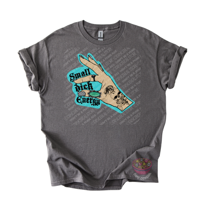 A dark gray graphic t-shirt featuring a hand graphic with the text 'Small dick Energy'.