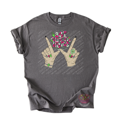 Dark gray unisex T-shirt featuring the phrase "Get Outta Here" above Y2K-inspired hands making the iconic gesture with colorful nails, alien accents, bracelets, and retro lettering.