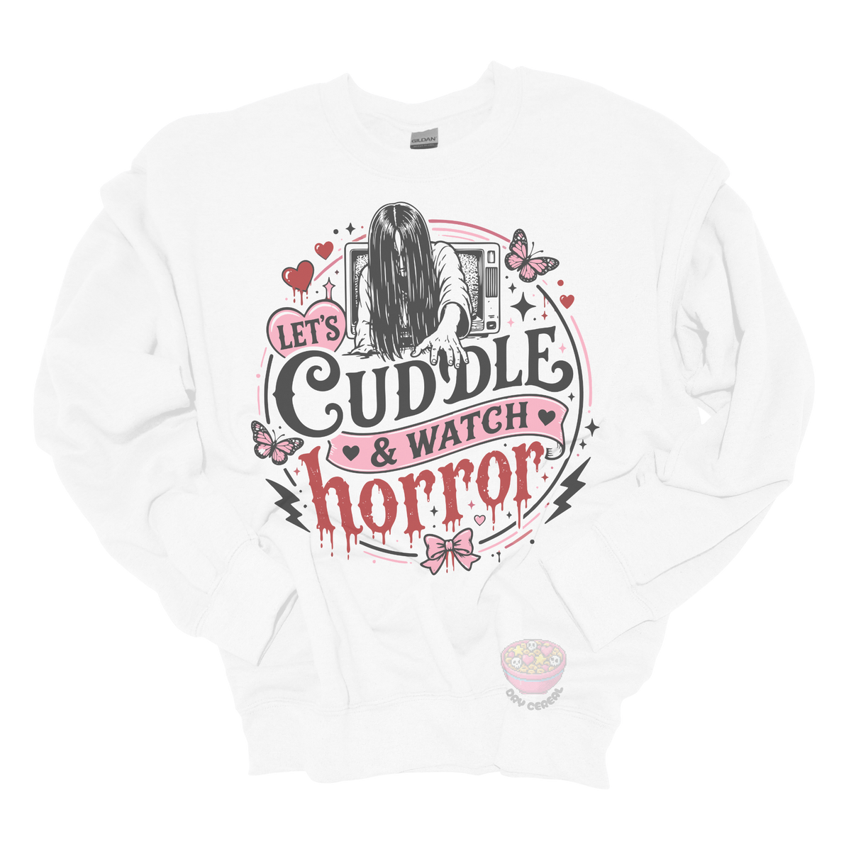 White crewneck sweatshirt featuring a spooky cute horror-inspired design with the phrase "Let's Cuddle & Watch Horror," pink hearts, butterflies, bows, and a creepy long-haired figure emerging from a television.
