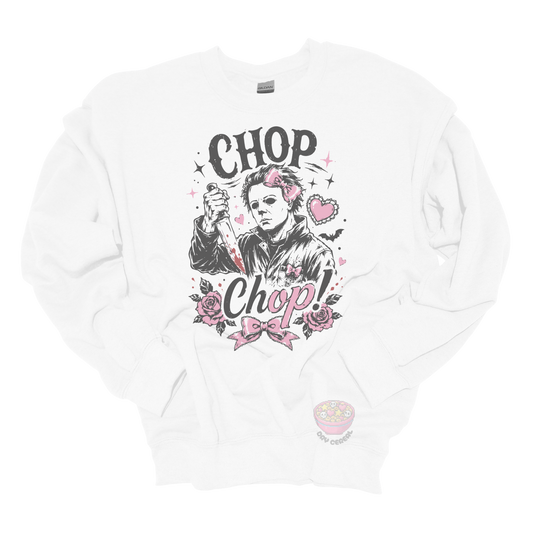 White crewneck sweatshirt featuring a spooky cute slasher-inspired design with pink bows, hearts, roses, bats, and the phrase "Chop Chop."