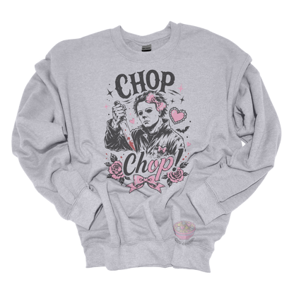 Grey crewneck sweatshirt featuring a spooky cute slasher-inspired design with pink bows, hearts, roses, bats, and the phrase "Chop Chop."