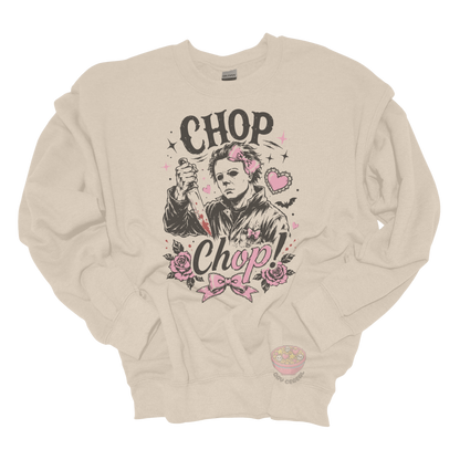 Beige crewneck sweatshirt featuring a spooky cute slasher-inspired design with pink bows, hearts, roses, bats, and the phrase "Chop Chop."