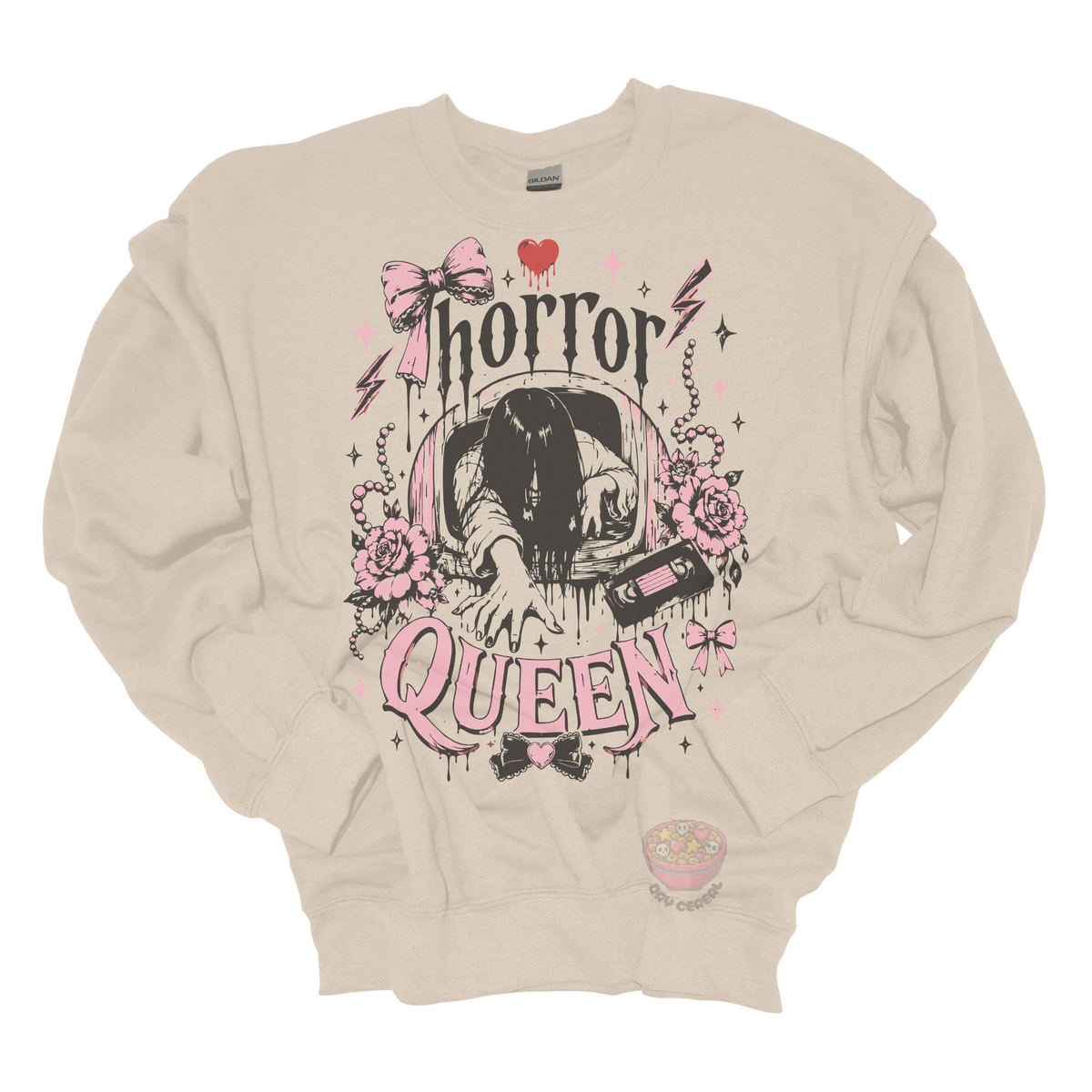 Beige crewneck sweatshirt featuring a horror-inspired long-haired ghost emerging from a television, surrounded by pink bows, roses, pearls, lightning bolts, and the phrase "Horror Queen."