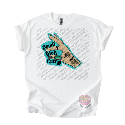 A white short-sleeve graphic t-shirt featuring a hand illustration with a skull and the text 'Small Dick Energy' in teal and black. 