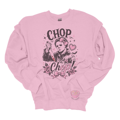 Light pink crewneck sweatshirt featuring a spooky cute slasher-inspired design with pink bows, hearts, roses, bats, and the phrase "Chop Chop."