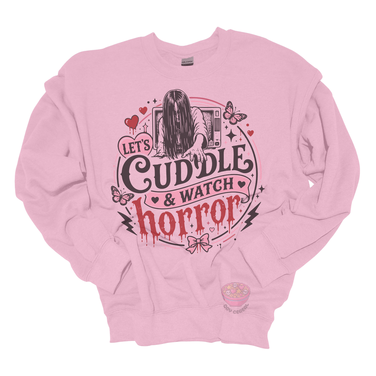 Light pink crewneck sweatshirt featuring a spooky cute horror-inspired design with the phrase "Let's Cuddle & Watch Horror," pink hearts, butterflies, bows, and a creepy long-haired figure emerging from a television.