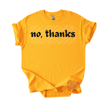 Gold unisex T-shirt featuring the phrase "No, thanks" in bold black gothic lettering across the chest.