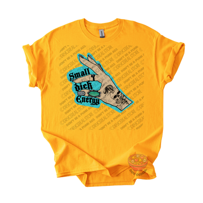 A bright yellow short-sleeve t-shirt with a graphic print on the front. The graphic features a hand , with the text 'Small dick Energy' in black.