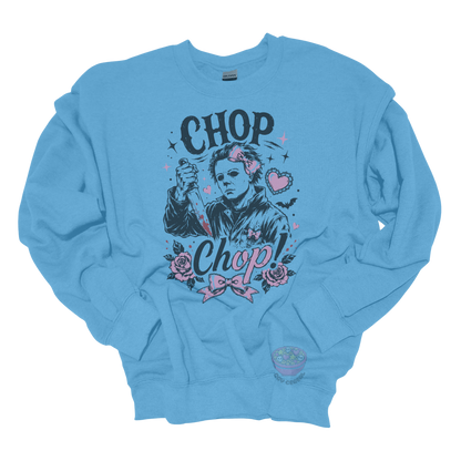 Light blue crewneck sweatshirt featuring a spooky cute slasher-inspired design with pink bows, hearts, roses, bats, and the phrase "Chop Chop."
