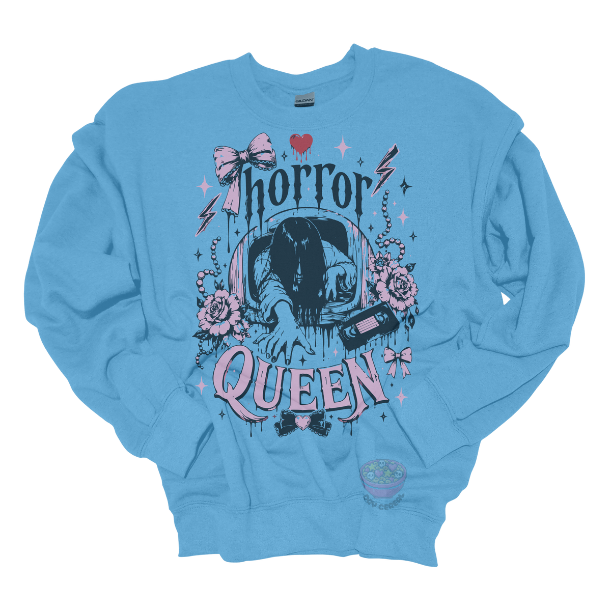 Light blue crewneck sweatshirt featuring a horror-inspired long-haired ghost emerging from a television, surrounded by pink bows, roses, pearls, lightning bolts, and the phrase "Horror Queen."
