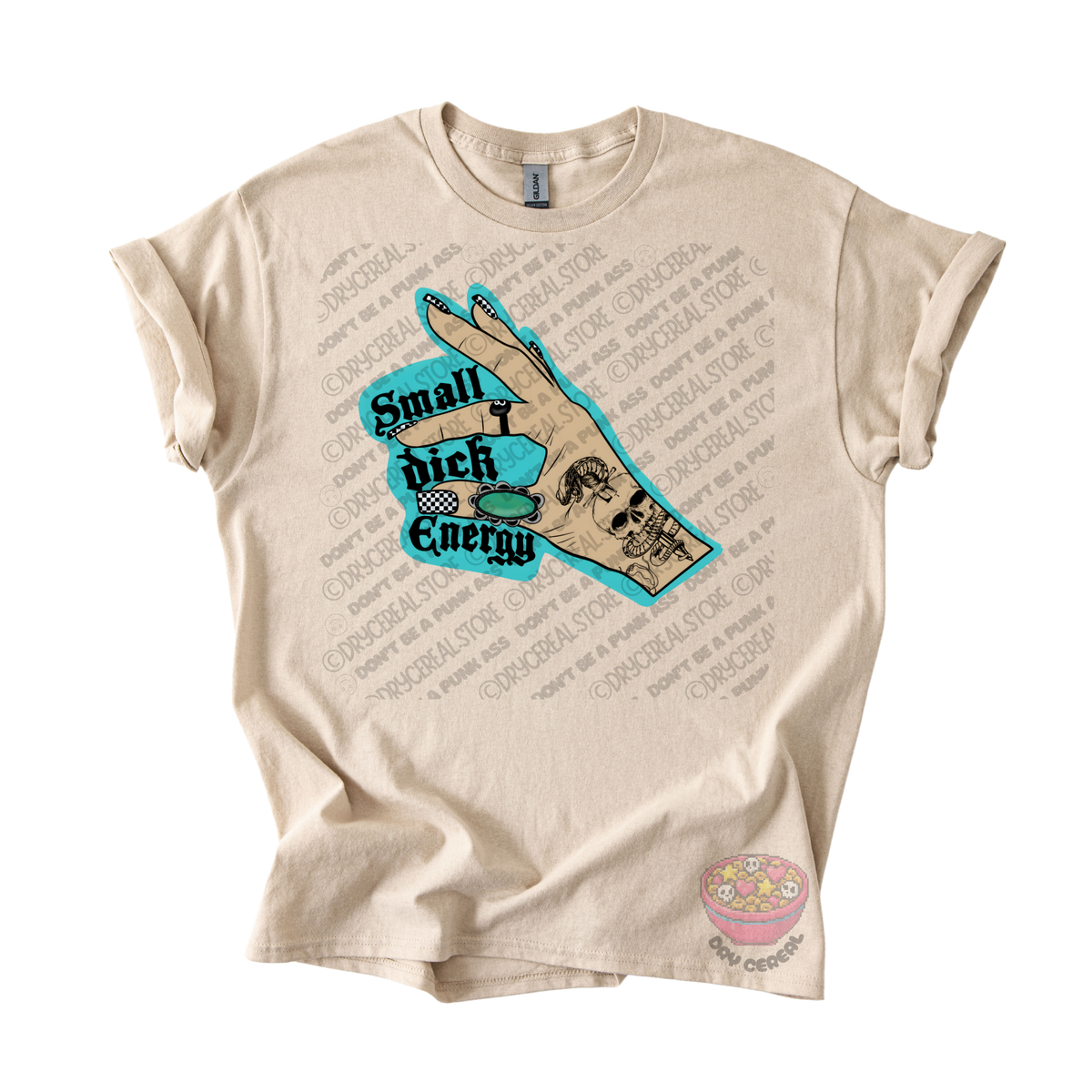 A beige graphic t-shirt featuring a hand illustration with a skull and the text 'Small dick Energy' in teal and black.