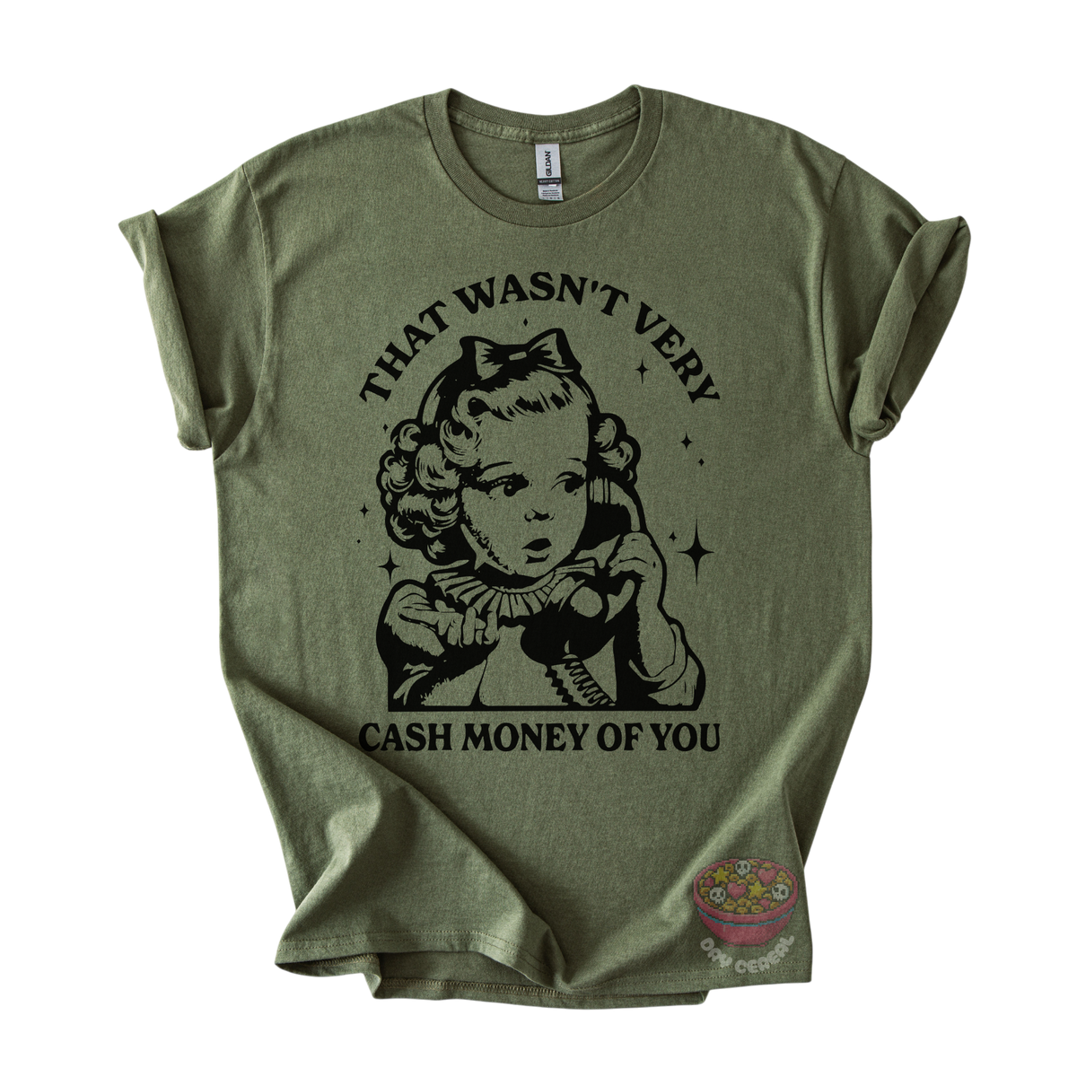An olive green short-sleeve t-shirt with a vintage-style black graphic of a young girl holding a telephone and the text 'THAT WASN'T VERY CASH MONEY OF YOU'. 
