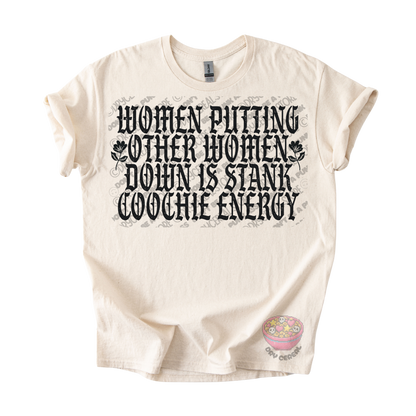 An off-white short-sleeve graphic t-shirt featuring the text 'WOMEN PUTTING OTHER WOMEN DOWN IS STANK COOCHE ENERGY' in a black gothic font, with a small pink donut graphic near the bottom right.