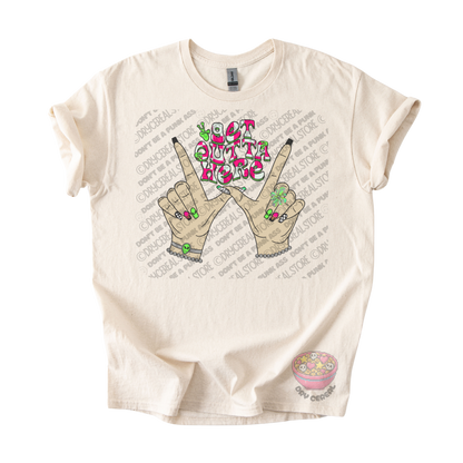 Natural unisex T-shirt featuring the phrase "Get Outta Here" above Y2K-inspired hands making the iconic gesture with colorful nails, alien accents, bracelets, and retro lettering.