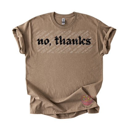 Light brown unisex T-shirt featuring the phrase "No, thanks" in bold black gothic lettering across the chest.