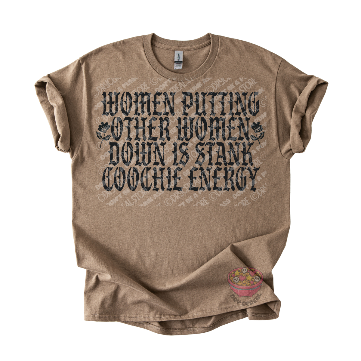 A brown graphic t-shirt with a distressed black text print that reads 'WOMEN PUTTING OTHER WOMEN DOWN IS STANK COOCHE ENERGY'. The t-shirt is laid flat against a white background.