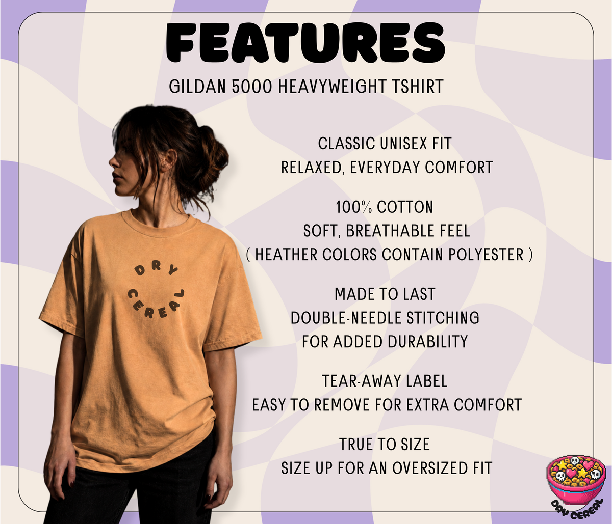 A promotional graphic for a Gildan 5000 heavyweight t-shirt. It features a woman modeling a mustard yellow crewneck t-shirt with a black circular graphic that reads 'DRY CEREAL'.
